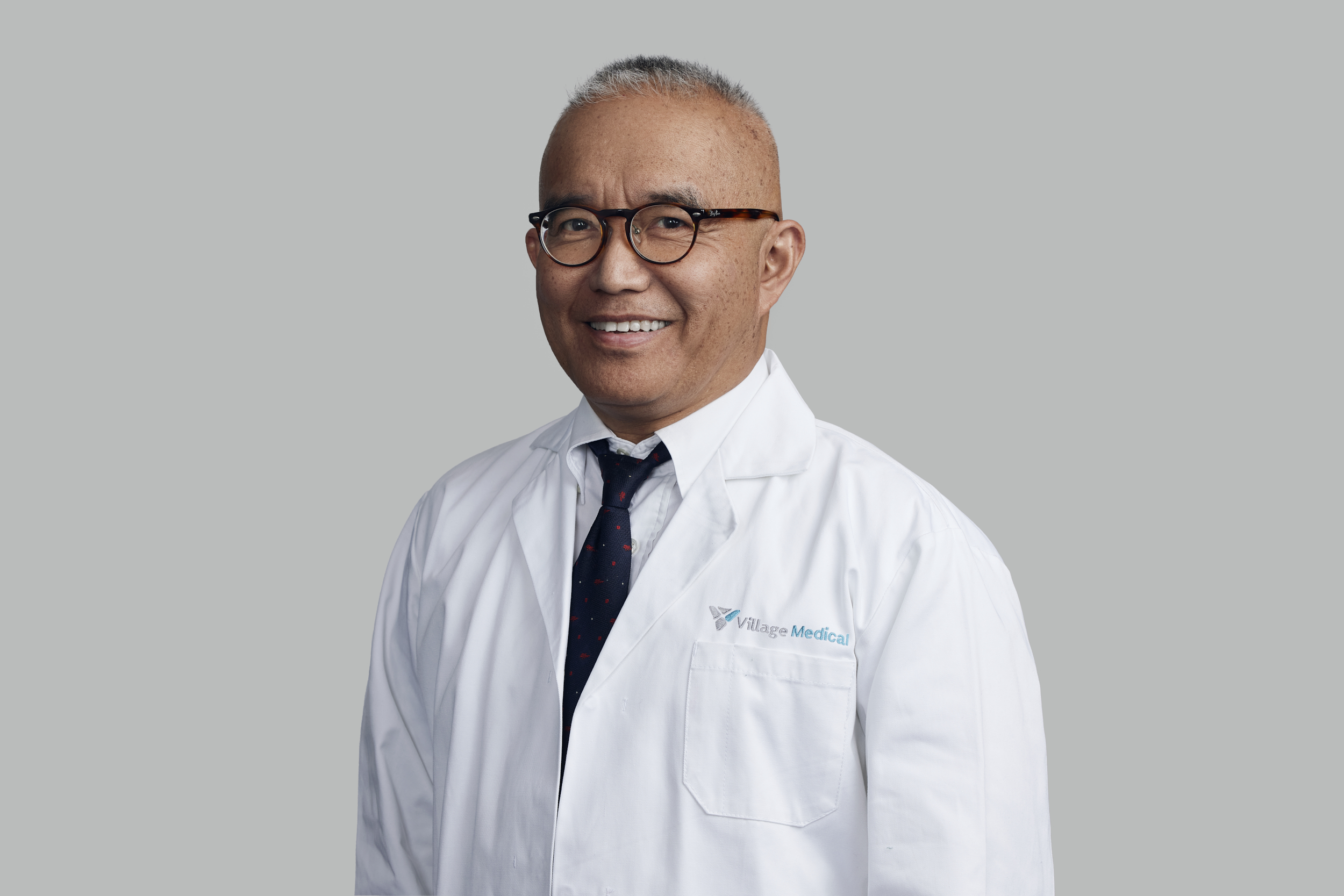 Professional headshot of Alfonso Tan, MD