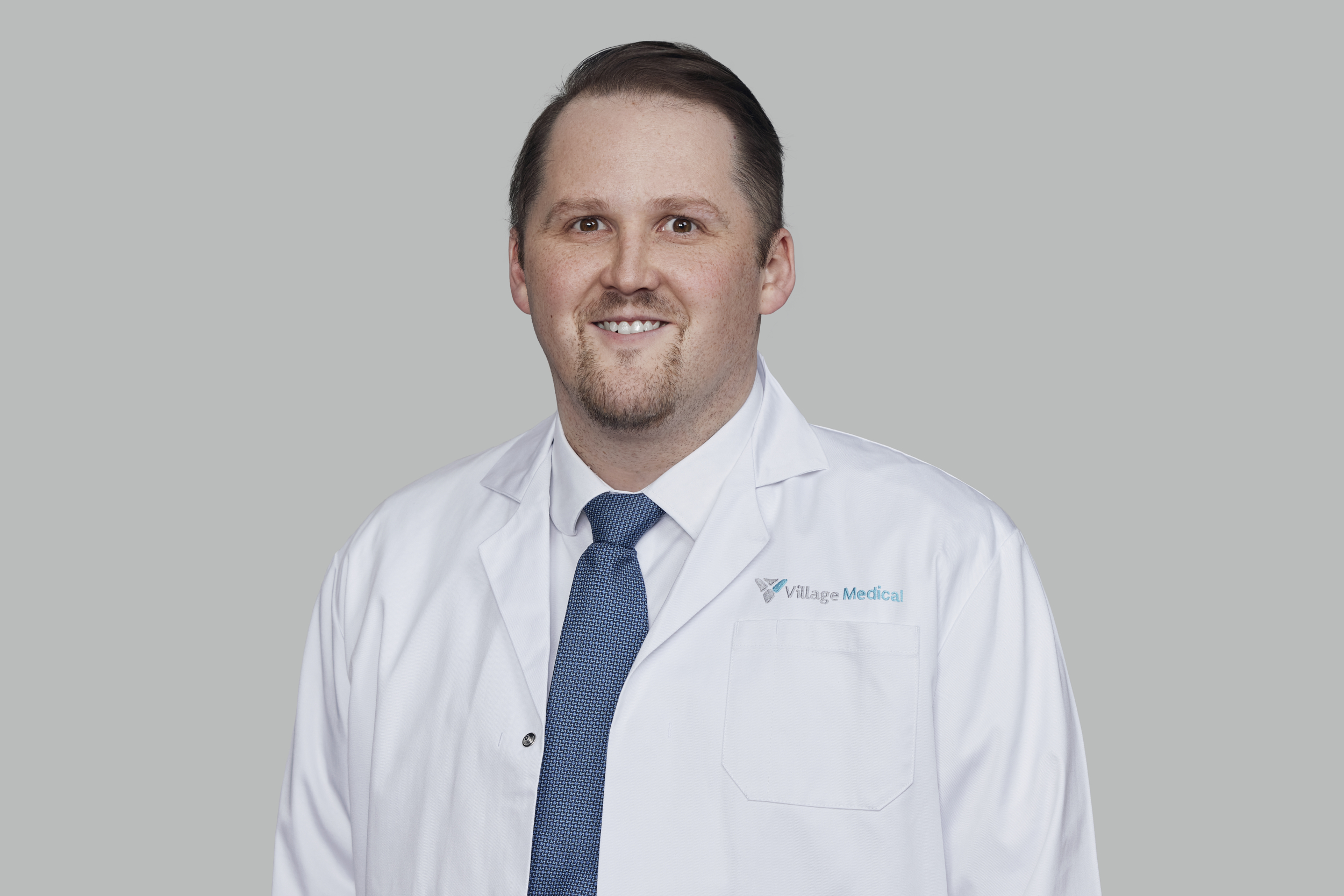 Professional headshot of William Hennon, MD