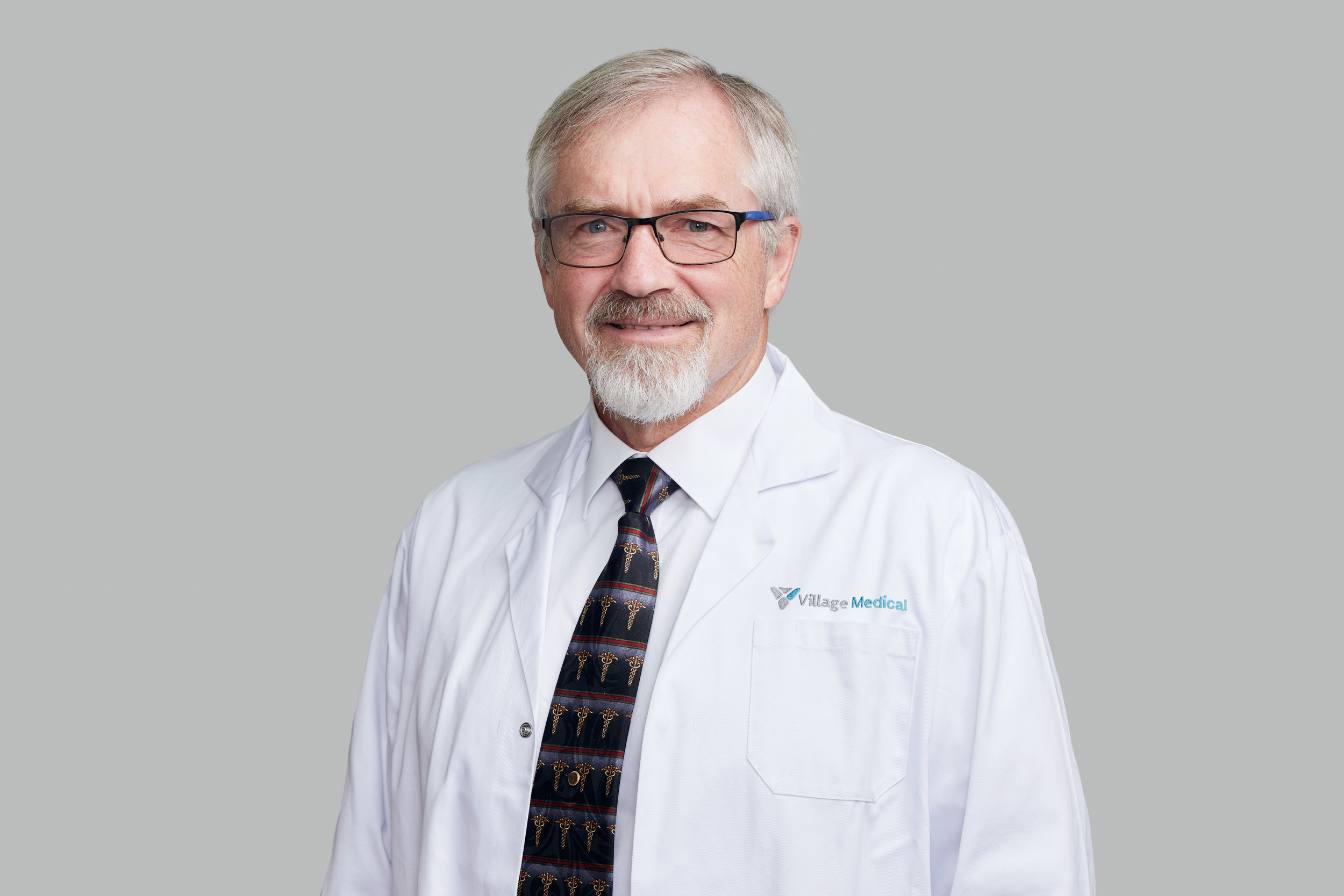 Professional headshot of John Spencer, MD