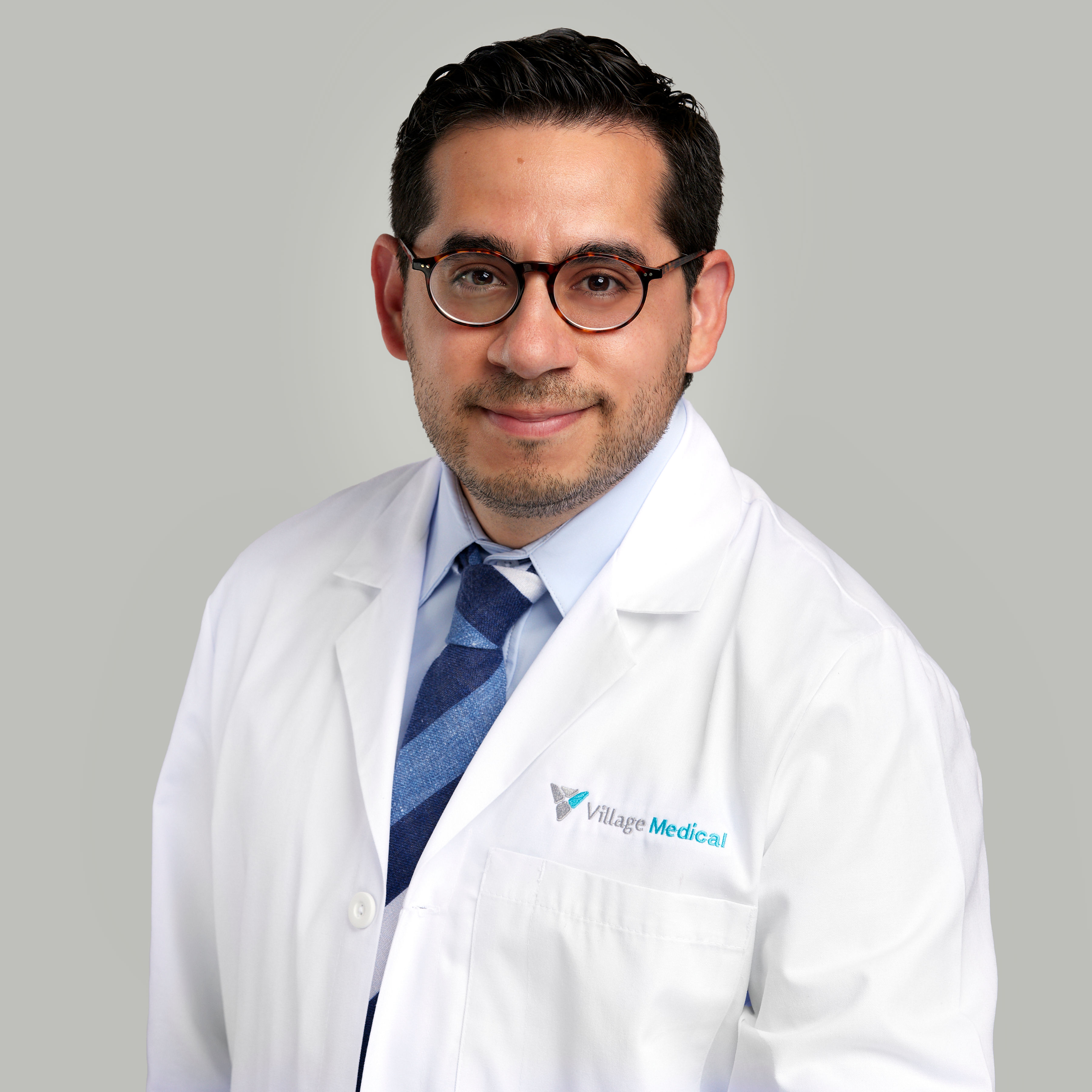 Professional headshot of Abel Flores, MD