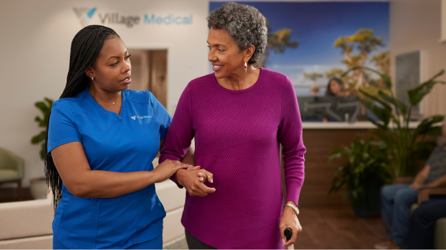 A Village Medical doctor helping a patient with home safety tips this holiday season