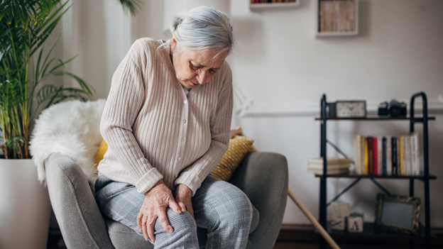 Older woman experiencing leg pain